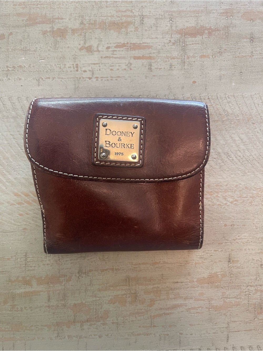 Dooney & Bourke Brown Leather Tri-Fold Wallet with Logo Plaque